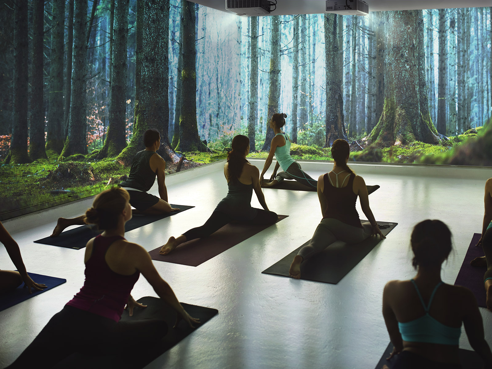 Fitness studio using a projector for workout sessions.
